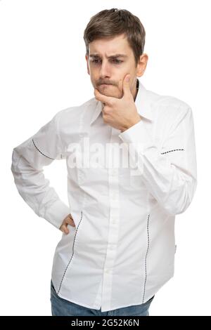 Young handsome tall slim white man with brown hair wondering in white shirt isolated on white background Stock Photo