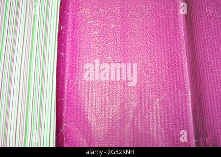 colorful striped wrapping paper and crumpled wavy bright pink textured Stock Photo