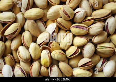 Pile of pistachios in the peel close up. Pistachios healthy omega 3