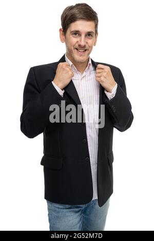 Young handsome tall slim white man with brown hair smiling in black blazer isolated on white background Stock Photo