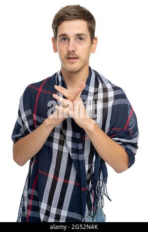 Young handsome tall slim white man with brown hair with his fingers crossed with scarf over his body isolated on white background Stock Photo