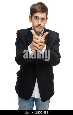 Young handsome tall slim white man with brown hair with clasped hands in black blazer isolated on white background Stock Photo