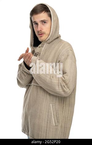 Young handsome tall slim white man with brown hair in natural style sweater isolated on white background Stock Photo