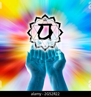 open hands and chakra symbol of Anahata Stock Photo