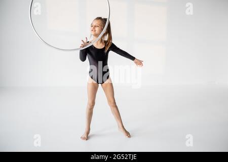 Girl practising rhythmic gymnastic with a ring Stock Photo