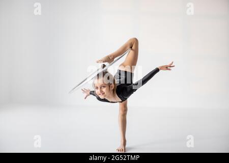 Girl practising rhythmic gymnastic with a ring Stock Photo