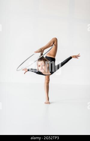 Girl practising rhythmic gymnastic with a ring Stock Photo