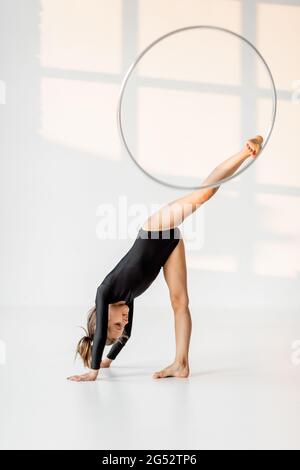 Girl practising rhythmic gymnastic with a ring Stock Photo