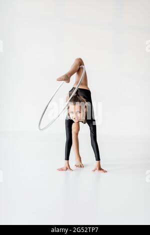 Girl practising rhythmic gymnastic with a ring Stock Photo