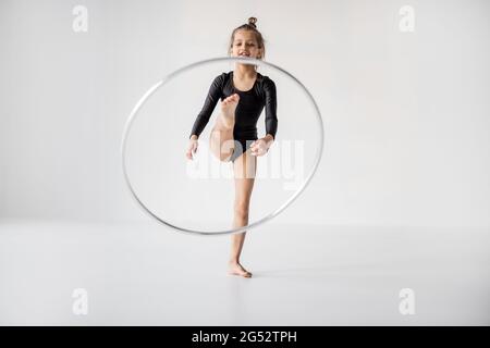 Girl practising rhythmic gymnastic with a ring Stock Photo