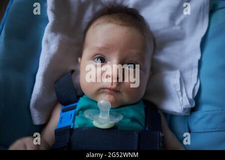 Small baby laying and wondering Stock Photo