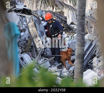 SURFSIDE, FLORIDA - JUNE 24: Search and Rescue personnel work after the ...