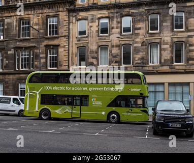 Edinburgh, Scotland, UK, 25th June 2021. New electric buses: the new green energy Lothian buses are spotted driving through the city as they are unveiled today, built in Falkirk by Alexander Dennis. The new vehicles, costing a total of £1.7 million, have been funded as part of a deal with SP Energy Networks’ green economy fund to help Edinburgh achieve net zero emissions by 2030 Stock Photo