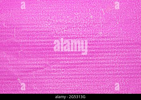 packaging paper, crumpled bright pink textured wrapping paper closeup Stock Photo
