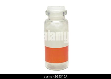 glass medicine bottle with two-color label, plastic lapped stopper, empty, with cotton absorbent inside Stock Photo