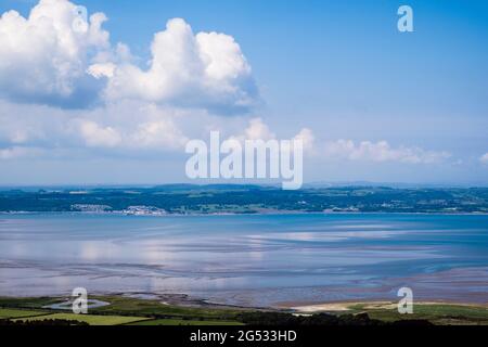 High view across Lavan Sands in Menai Strait to Beaumaris on Isle of Anglesey from above Llanfairfechan, Conwy, north Wales, UK, Britain Stock Photo