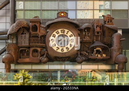 tokyo, japan - june 20 2021: Public art sculpture made of copper depicting the Ghibli Clock designed by Japanese artist Hayao Miyazaki and built by Ku Stock Photo
