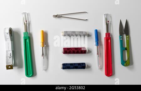 various sewing equipment on a white background Stock Photo