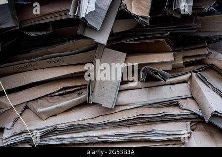 Close up of a stack of flattened old cardboard boxes. Stock Photo
