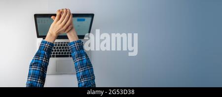 top view of person hands close cover or block the laptop webcam, being afraid of spy hack the camera Stock Photo