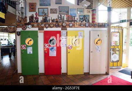 Hamburg, Germany. 25th June, 2021. Telephone booths stand in the entrance area of the Duckdalben Seamen's Club. Credit: Daniel Reinhardt/dpa/Alamy Live News Stock Photo