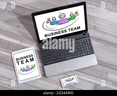 Business team concept shown on different information technology devices Stock Photo
