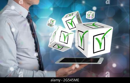 Validation concept above a tablet held by a man Stock Photo