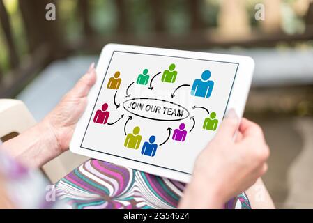 Join our team concept shown on a tablet held by a woman Stock Photo