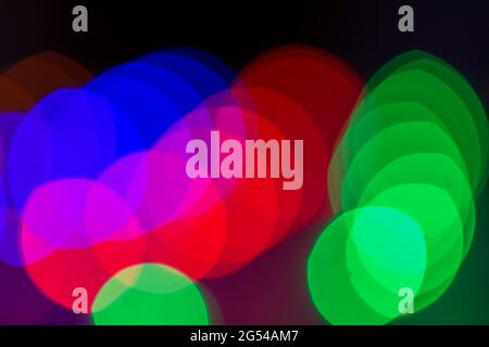 blurred bokeh light background , glare and glowing lights in night city, modern beautiful bright background Stock Photo