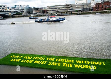 Tate Modern, London. July 25th 2021. A message from Ben Okri to world governments grown on a 16x4 metres carpet of living grass,  This was commissione Stock Photo