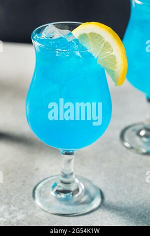 Refreshing Boozy Blue Hawaii Cocktail with Lemon Stock Photo