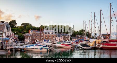 Boats moored in the inner harbour on a lovely summer evening at the seaside town of Padstow in Cornwall. Stock Photo