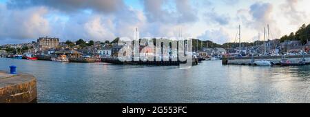 Panorama of boats moored in the harbour at the seaside town of Padstow in Cornwall. Stock Photo