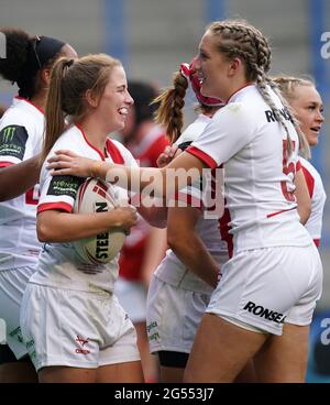 England's Tara Jones (left) celebrates scoring a try during the women's international match at the Halliwell Jones Stadium, Warrington. Picture date: Friday June 25, 2021. Stock Photo