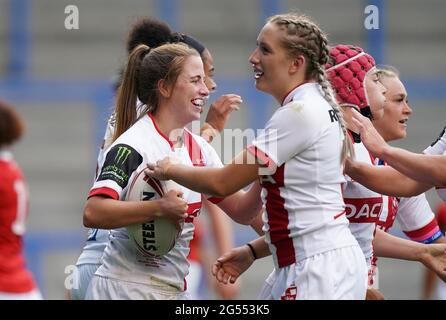 England's Tara Jones (left) celebrates scoring a try during the women's international match at the Halliwell Jones Stadium, Warrington. Picture date: Friday June 25, 2021. Stock Photo