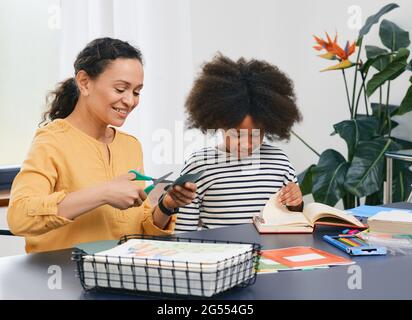 Autism. Care of girl child mental health with a child psychologist using art psychotherapy session Stock Photo