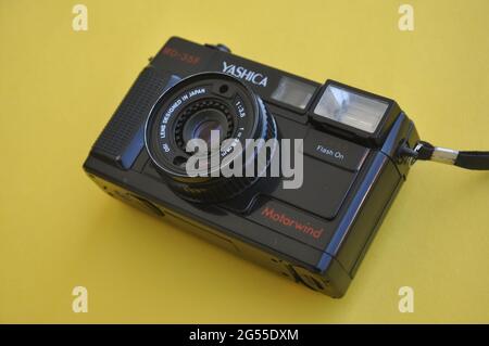 Mandi, Himachal Pradesh, India - 04 24 2021: Photo of a Yashica film roll camera MD-35f isolated over yellow background Stock Photo