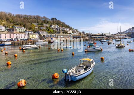 Boats moored on the Looe River in Cornwall. Looe is a very popular holiday resort, and is also notable for its fish market and numerous fishing boats. Stock Photo