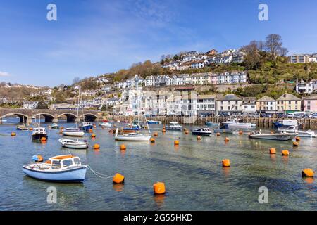 Boats moored on the Looe River in Cornwall. Looe is a very popular holiday resort, and is also notable for its fish market and numerous fishing boats. Stock Photo