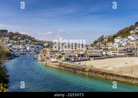 Looe beach, river and harbour. Looe is an extremely popular holiday resort, and is also notable for its fish market and numerous fishing boats. Stock Photo