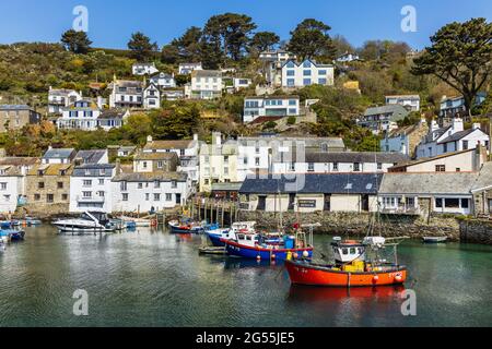 Fishing boats in the harbour at Polperro, a charming and picturesque fishing village in south east Cornwall. Stock Photo
