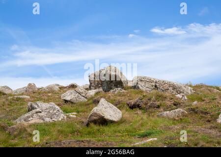 Landscape of large rocks in a remote grassland on a beautiful sunny day Stock Photo