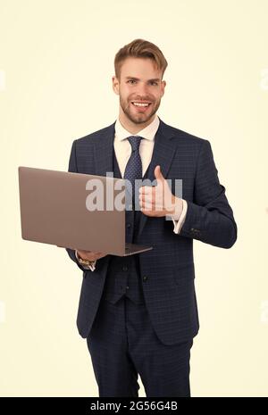 Best online courses. Manager show thumbs up holding laptop. Running online business. Digital marketing. Freelance online. New technology. Business Stock Photo