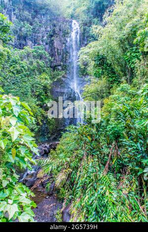 Road to Hana: Wailua Falls located just past mile marker 45 at Honolewa Stream on Hana Highway. One of Maui's most photographed waterfalls. Stock Photo