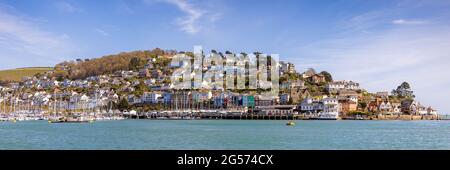 A panoramic view of Kingswear and its colourful buildings from across the River Dart in Dartmouth, Devon, England. Stock Photo