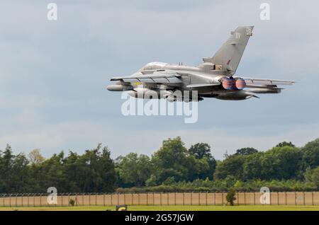 Royal Air Force Panavia Tornado GR4 keeping low on take off to carry out a 'show of force' air display at Royal International Air Tattoo, UK. Reheat