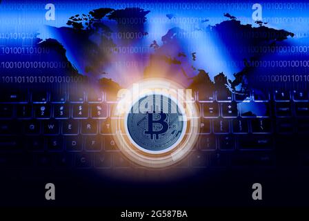 Bitcoin against World map and computer keyboard, cgi Stock Photo