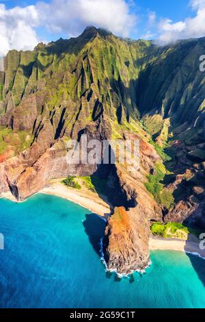 Hawaii beach, Kauai. Na pali coast view from helicopter. Hawaiian travel destinaton. Napali coastline in Kaui, Hawaii, USA. Aerial of Honopu arch Stock Photo