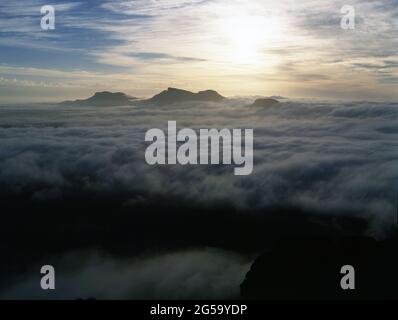 HEAVY CLOUD COVER OVER THE STIRLING RANGES NATIONAL PARK AT SUNSET. THE RANGE IS RENOWNED FOR ITS UNUSUAL CLOUD FORMATIONS. WESTERN AUSTRALIA. Stock Photo