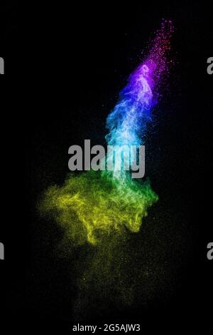 Multicolored powder explosion on black background.Colorful of pastel powder explosion. Stock Photo